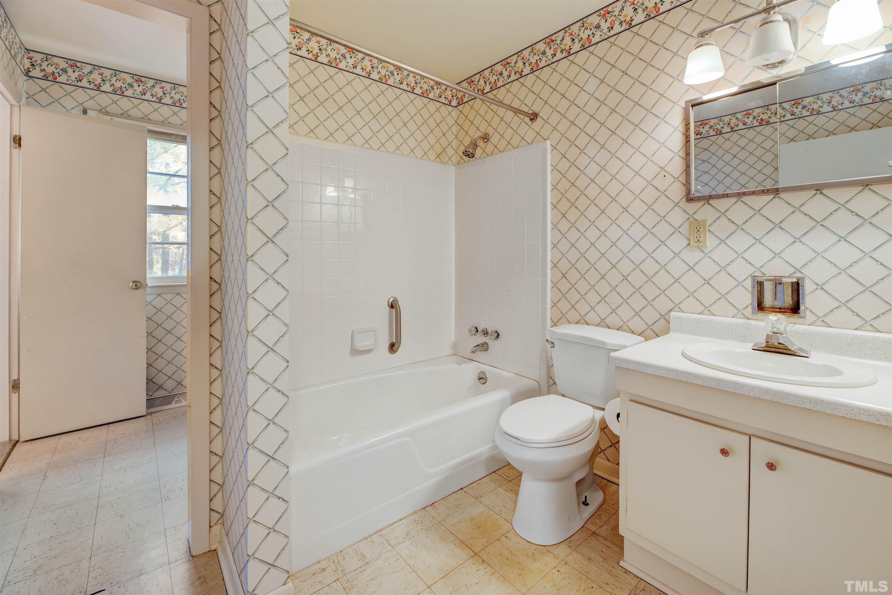1807 Euclid Road Durham, NC 27713 - Photo 18 of 19 a bathroom with a sink toilet and shower