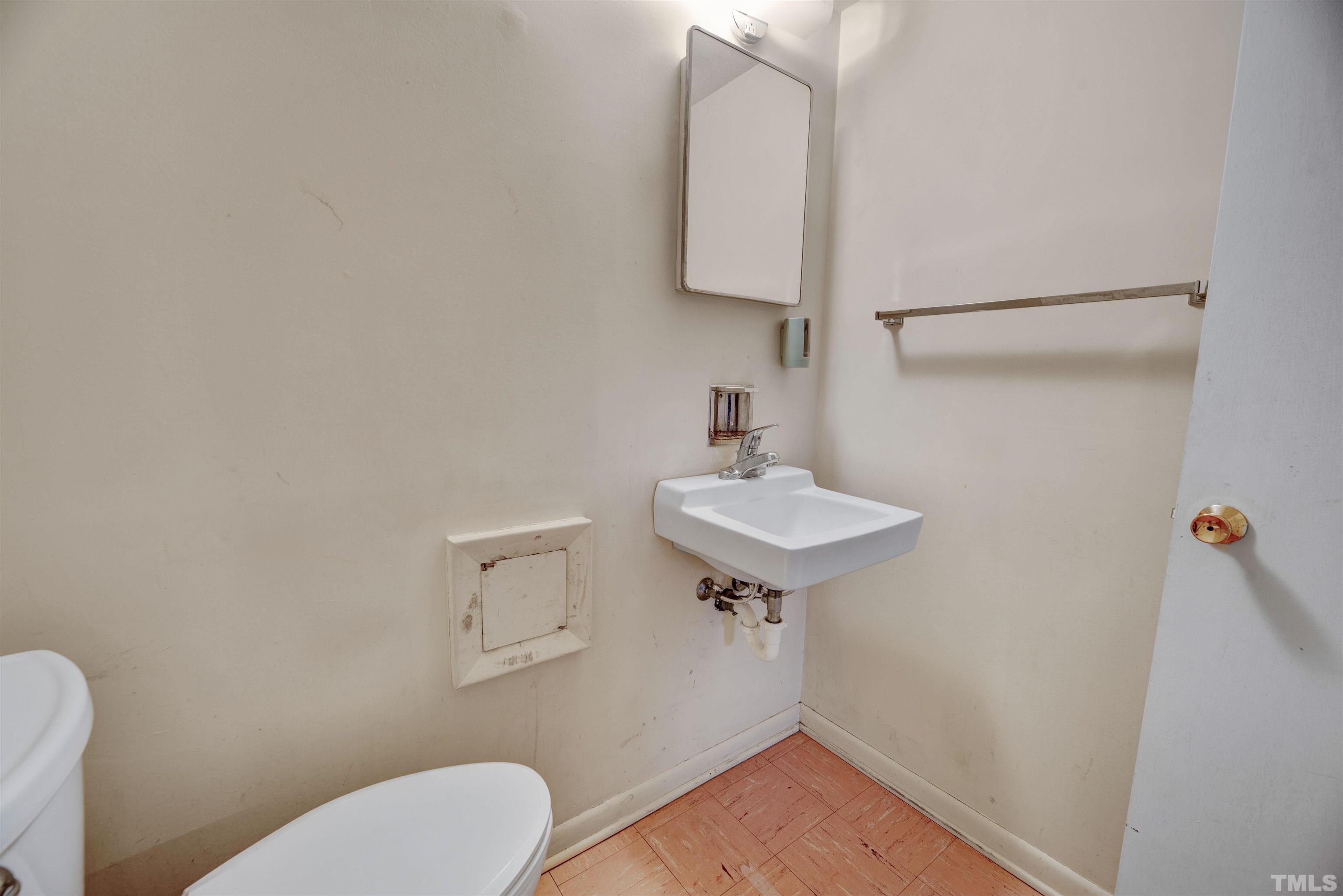 1807 Euclid Road Durham, NC 27713 - Photo 19 of 19 a bathroom with a sink mirror and toilet