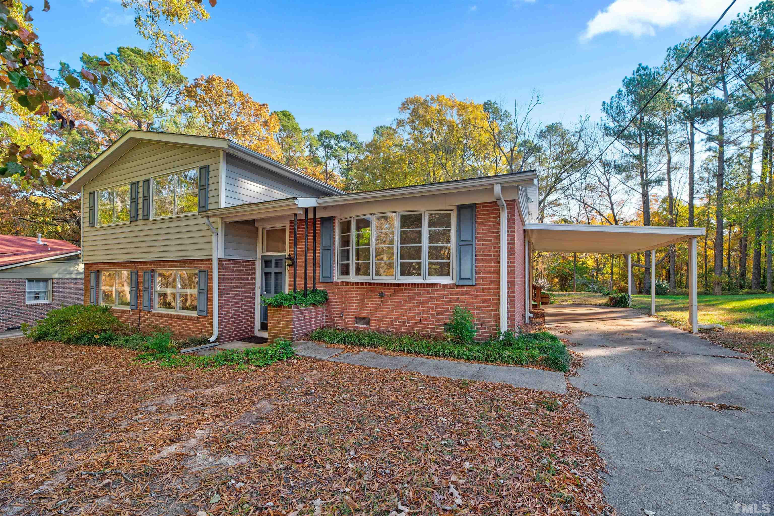 1807 Euclid Road Durham, NC 27713 - Photo 2 of 19 a front view of a house with a yard and garage