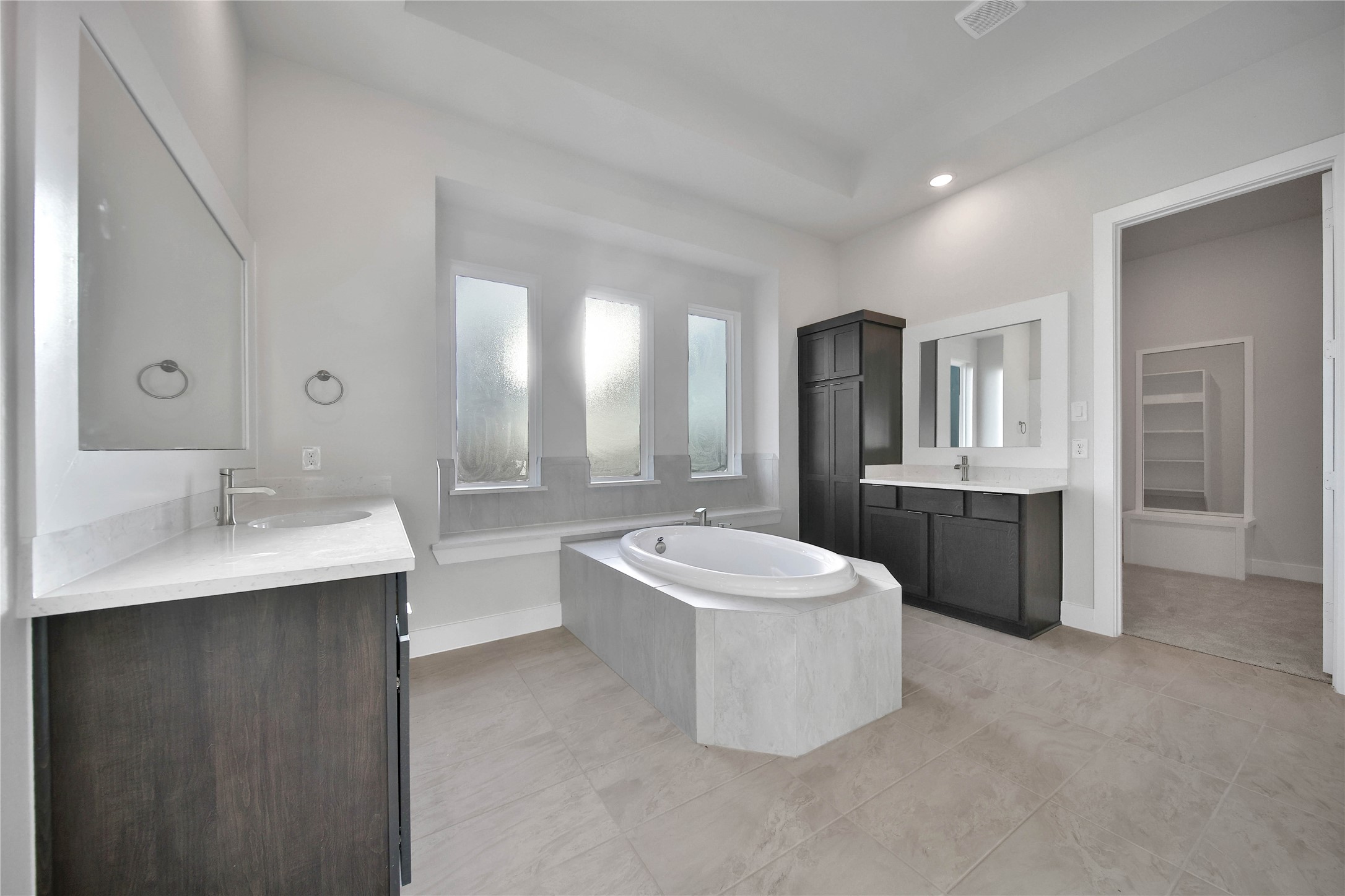 4602 Magnolia Bend Drive Rosharon, TX 77583 - Photo 17 of 39 a spacious bathroom with a double vanity sink mirror and bathtub