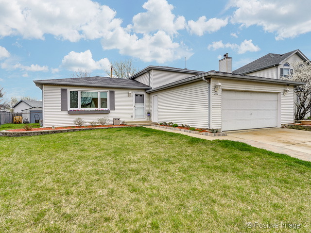 705 Rockhurst Road Bolingbrook, IL 60440 - Photo 1 of 25 a front view of house with yard and green space