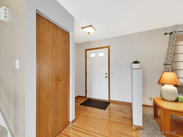 705 Rockhurst Road Bolingbrook, IL 60440 - Photo 2 of 25 a view of room with wooden floor and chair