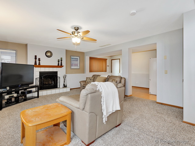 705 Rockhurst Road Bolingbrook, IL 60440 - Photo 12 of 25 a spacious bedroom with a bed and a flat screen tv