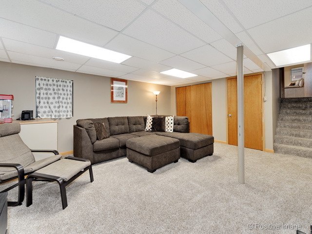 705 Rockhurst Road Bolingbrook, IL 60440 - Photo 20 of 25 a spacious bedroom with a bed and a couch