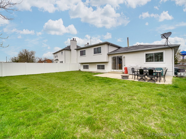 705 Rockhurst Road Bolingbrook, IL 60440 - Photo 21 of 25 a view of a yard with a house in the background