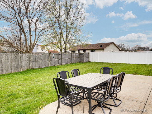 705 Rockhurst Road Bolingbrook, IL 60440 - Photo 22 of 25 a view of a chairs and table in patio of the backyard