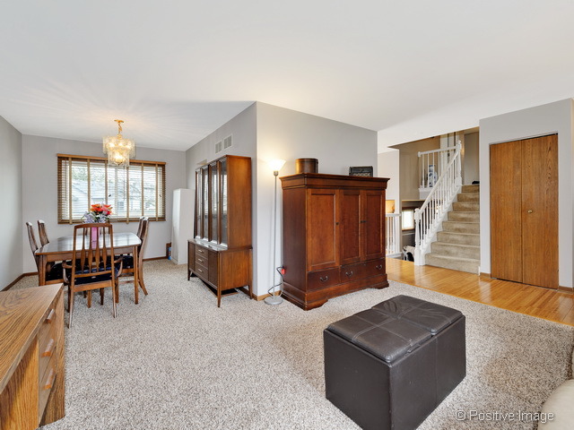 705 Rockhurst Road Bolingbrook, IL 60440 - Photo 5 of 25 a living room with furniture and a window