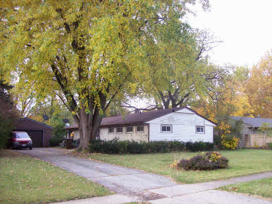 4713 Highcrest Road Rockford, IL 61107 - Photo 1 of 1 a front view of a house with a yard