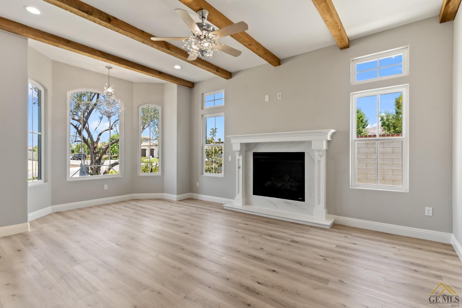 Undisclosed Address Bakersfield, CA 93311 - Photo 19 of 75 a view of an empty room with a window and fireplace