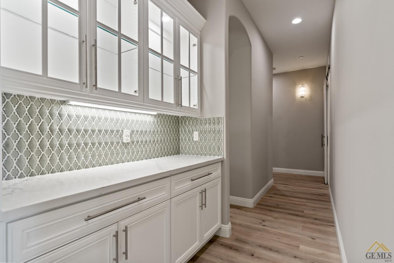 Undisclosed Address Bakersfield, CA 93311 - Photo 30 of 75 a view of a kitchen cabinets and wooden floor