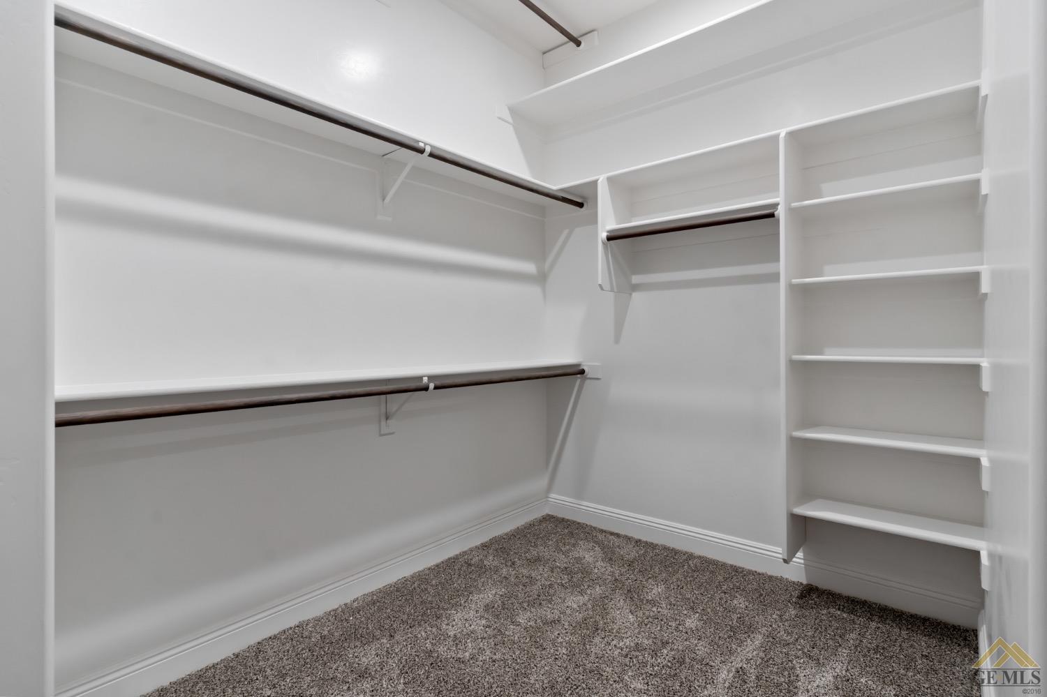 Undisclosed Address Bakersfield, CA 93311 - Photo 43 of 75 a view of an empty walk in closet