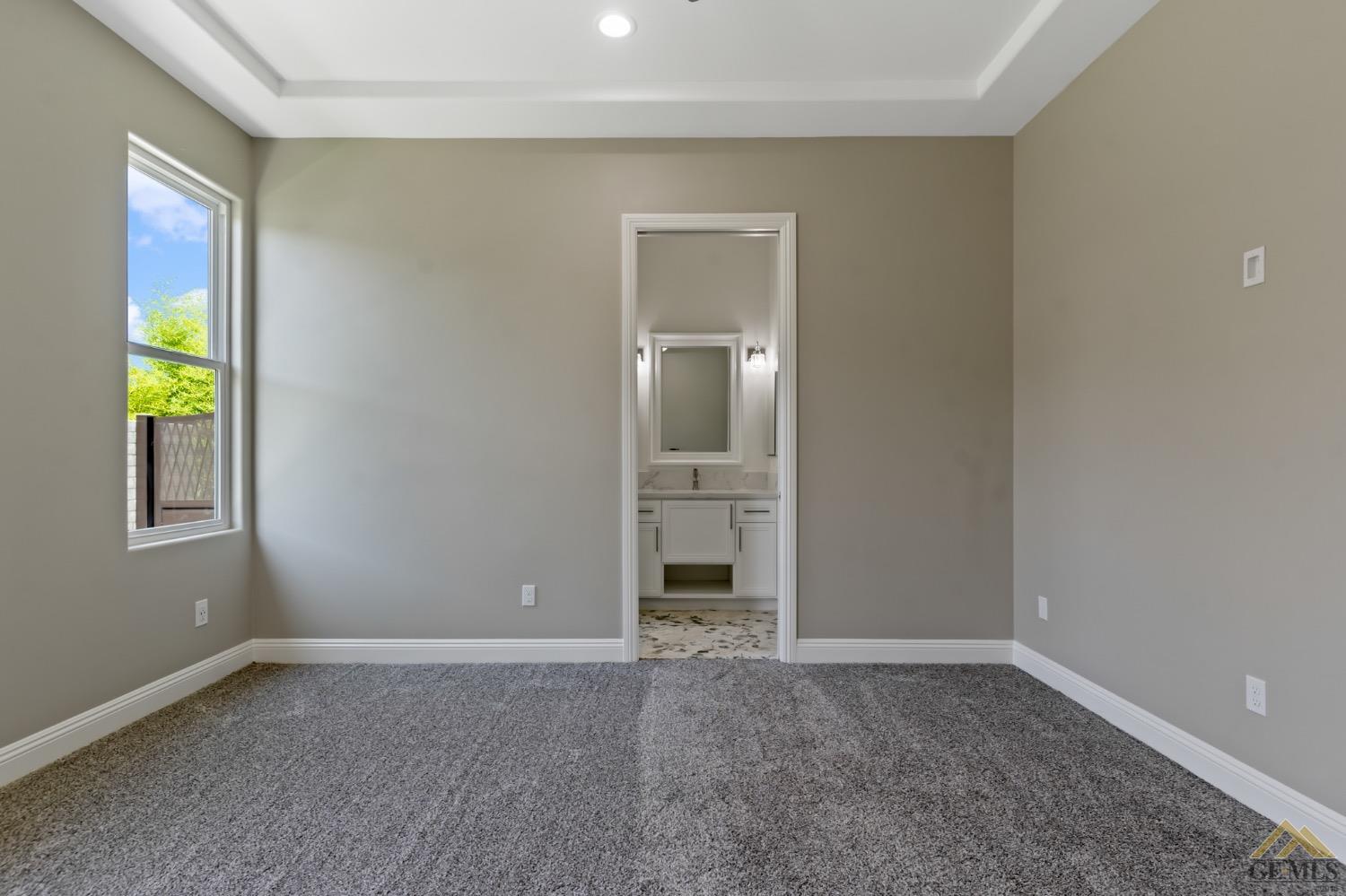 Undisclosed Address Bakersfield, CA 93311 - Photo 52 of 75 a view of an empty room with window and bathroom
