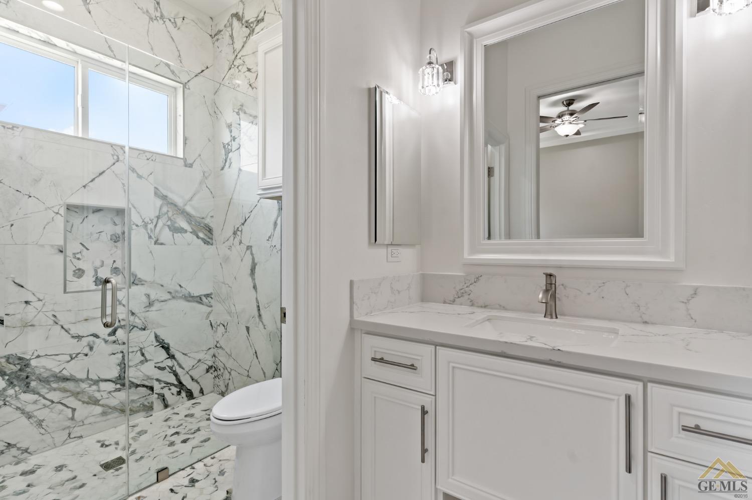 Undisclosed Address Bakersfield, CA 93311 - Photo 53 of 75 a bathroom with a granite countertop sink toilet and shower