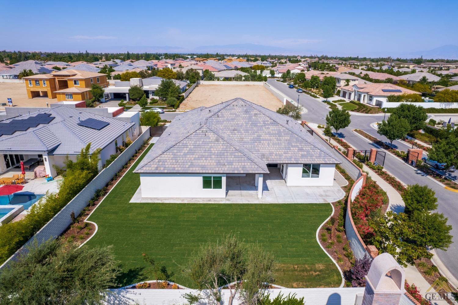 Undisclosed Address Bakersfield, CA 93311 - Photo 71 of 75 an aerial view of residential houses with outdoor space and trees