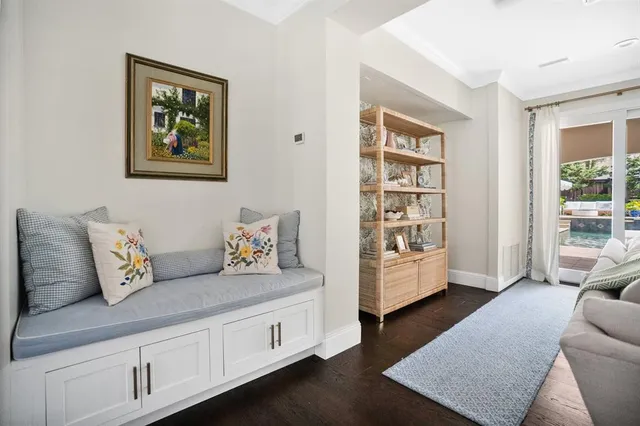 a living room with furniture and a night stand