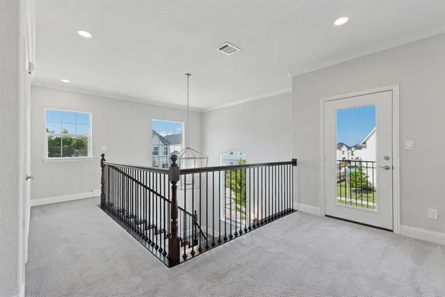 a view of a hallway with windows