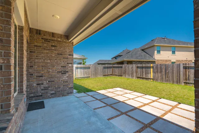 a view of a house with swimming pool and porch