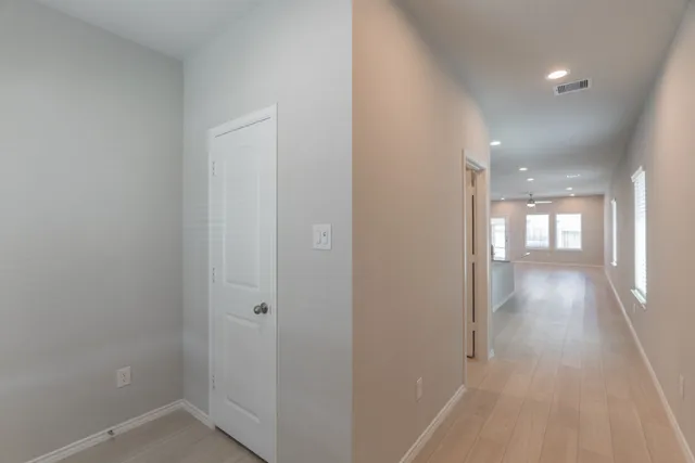 a view of hallway with a couch