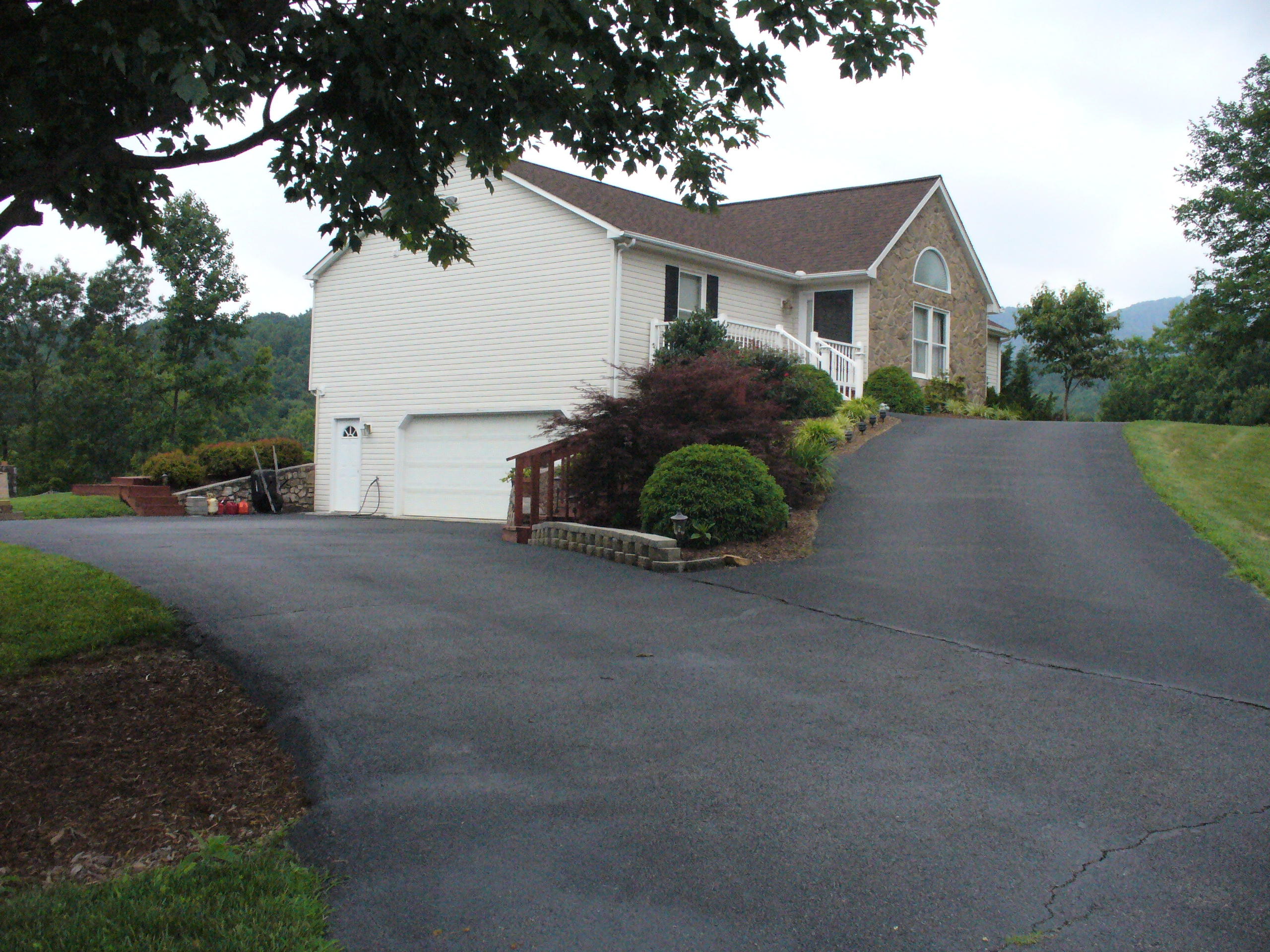 211 Oak Ridge Court Blue Ridge, VA 24064 - Photo 1 of 20 a house with a outdoor space