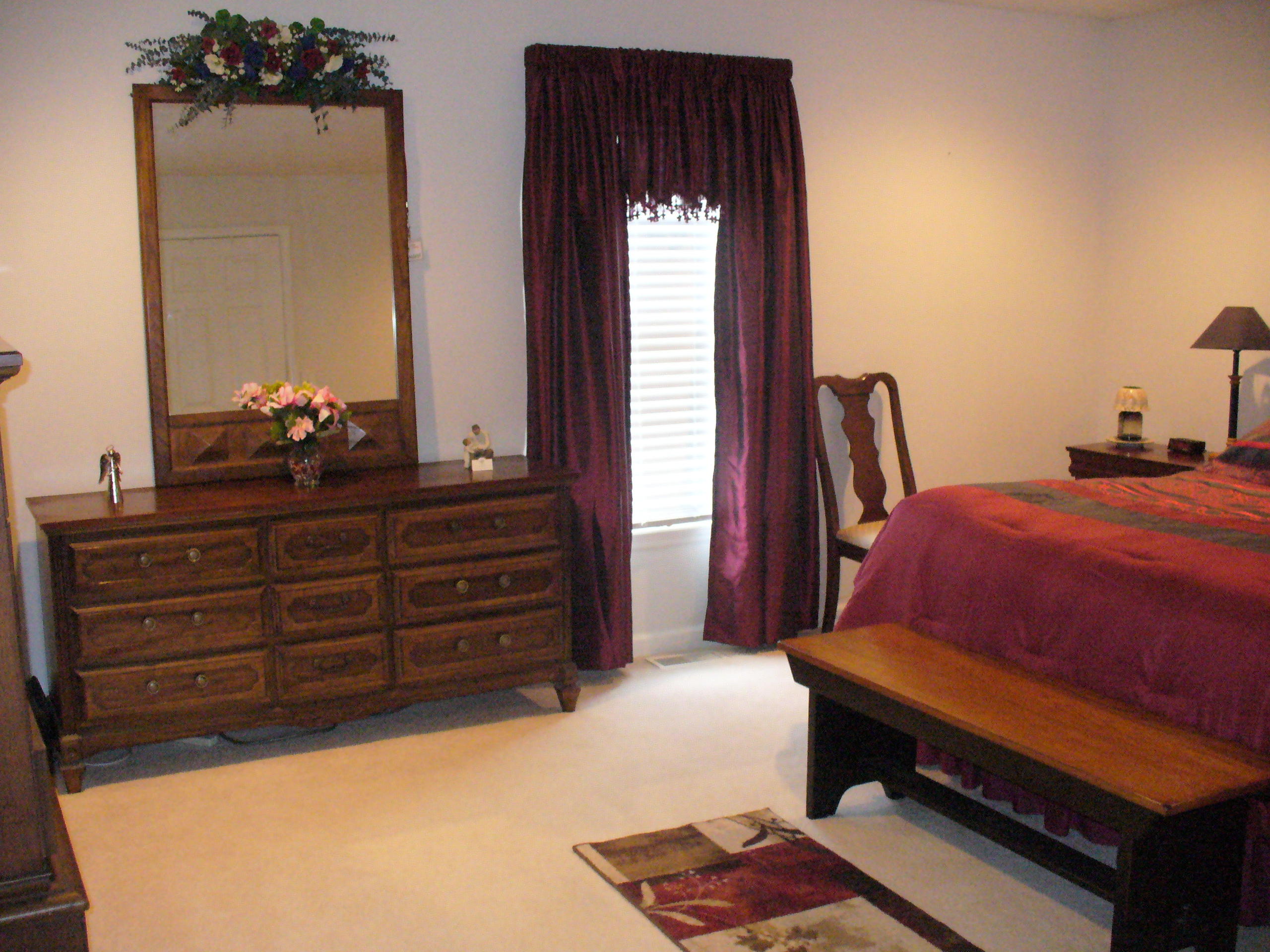 211 Oak Ridge Court Blue Ridge, VA 24064 - Photo 11 of 20 a bed room with a bed and a dresser