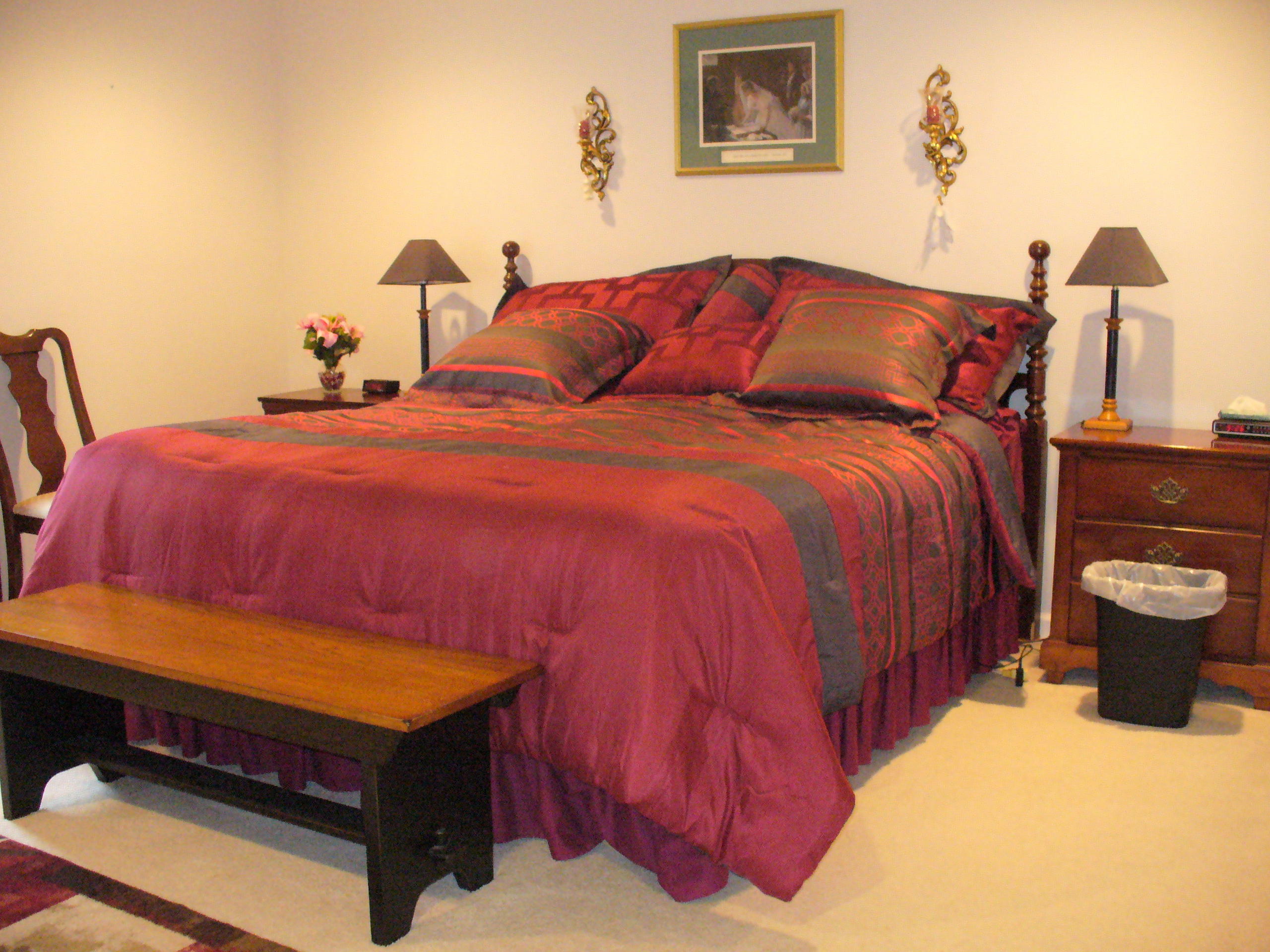 211 Oak Ridge Court Blue Ridge, VA 24064 - Photo 13 of 20 a bedroom with a bed and wooden floor