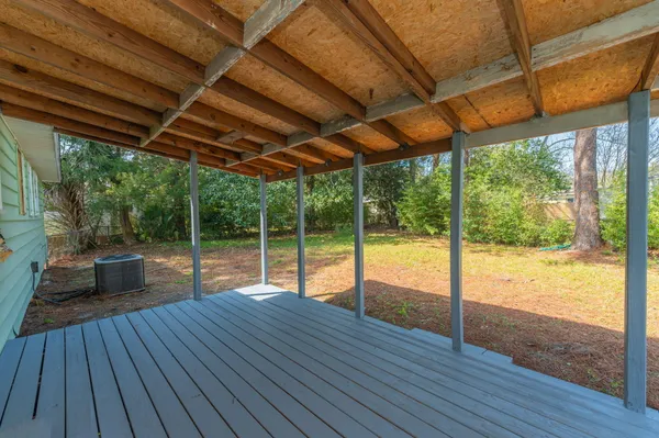 a porch with wooden floor in outdoor space