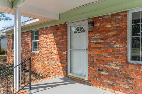 a front view of a house with a glass door