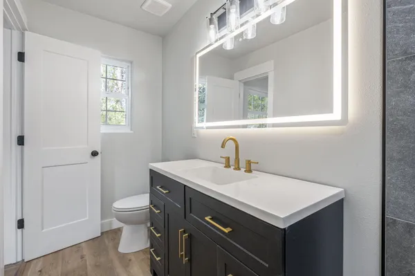 a bathroom with a sink and a toilet