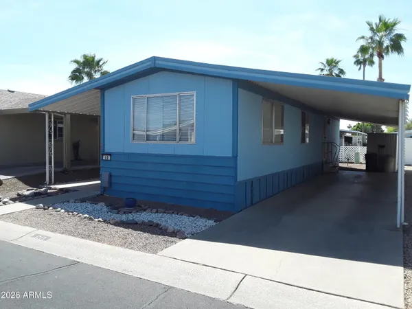 a kitchen with stainless steel appliances granite countertop a refrigerator a stove top oven a sink and dishwasher