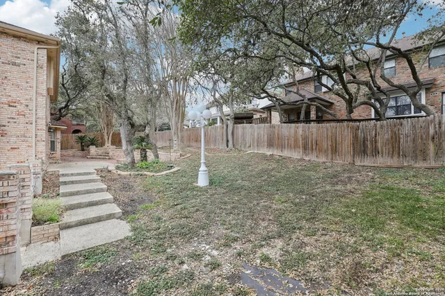 a view of backyard with green space