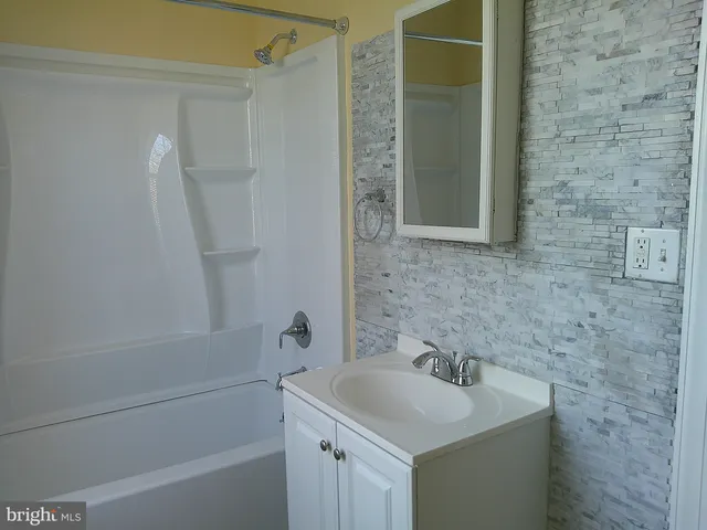 a bathroom with a sink and a bathtub