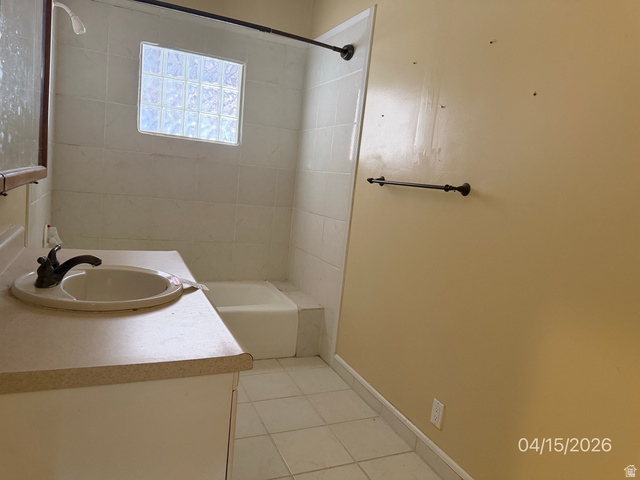 250 South Main Street Fillmore, UT 84631 - Photo 7 of 12 Bathroom featuring vanity, light tile patterned floors, and tub / shower combination