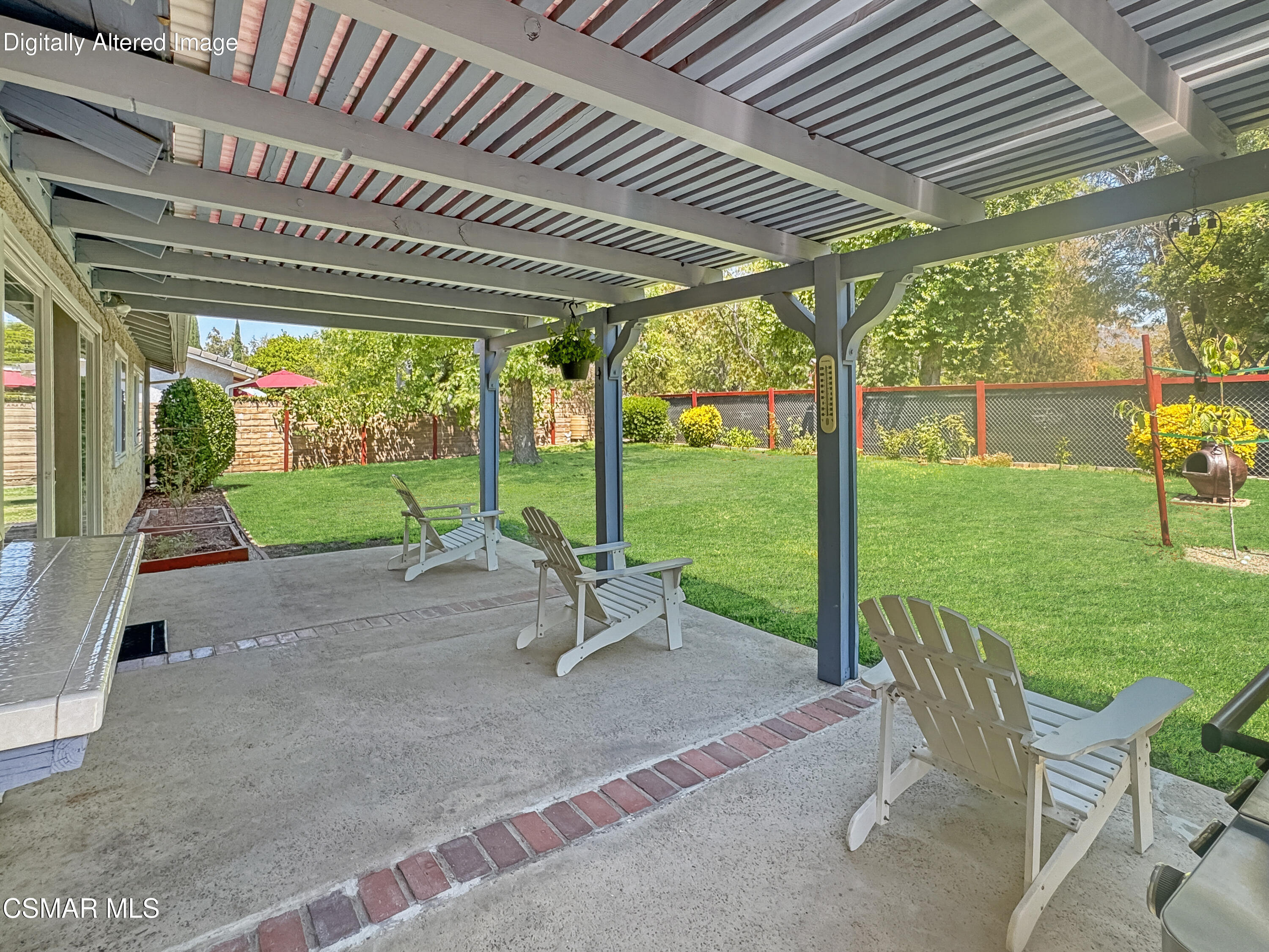 2948 Texas Avenue Simi Valley, CA 93063 - Photo 21 of 32 a view of a patio with table and chairs next to a yard