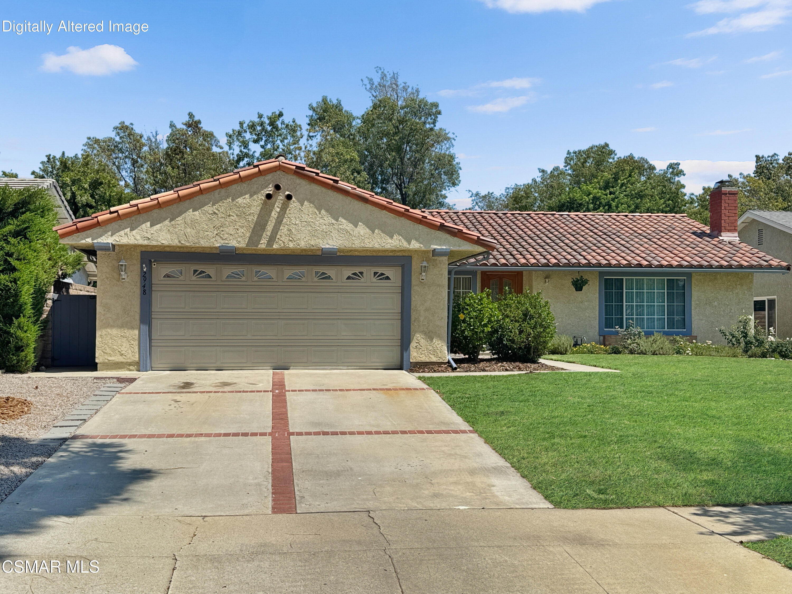 2948 Texas Avenue Simi Valley, CA 93063 - Photo 31 of 32 a front view of a house with a yard and garage