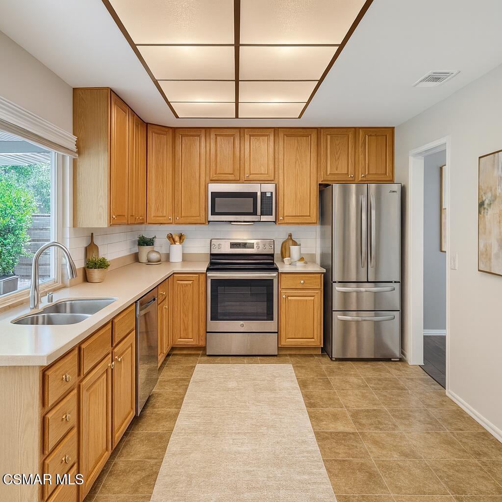 2948 Texas Avenue Simi Valley, CA 93063 - Photo 9 of 32 a kitchen with refrigerator cabinets and a sink