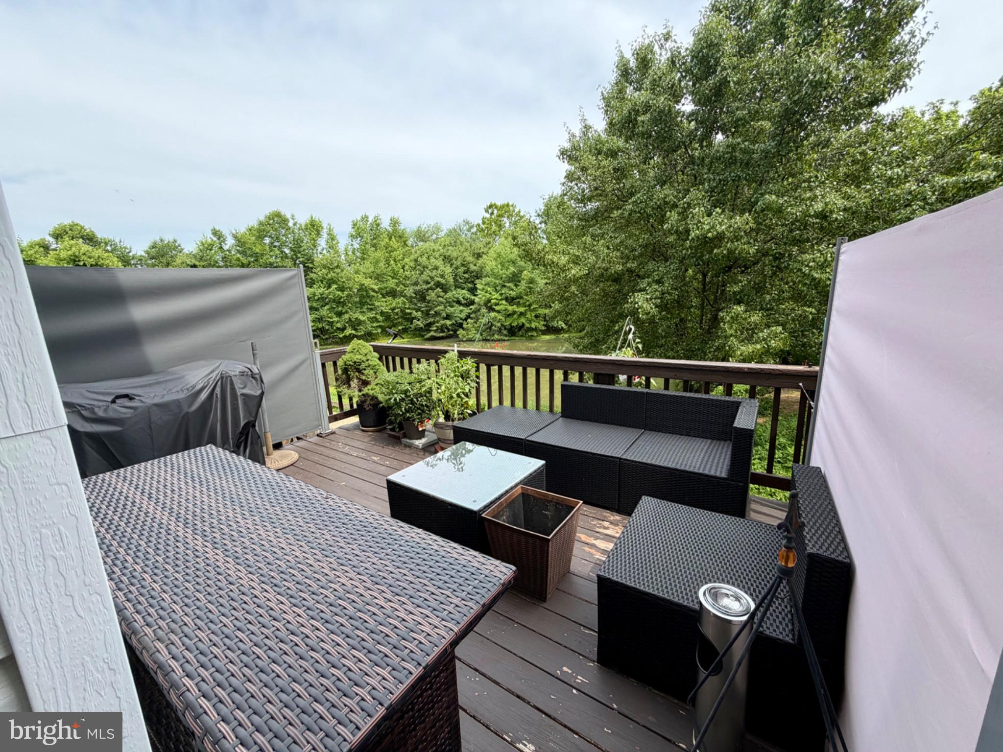 2502 Short Putt Court Crofton, MD 21114 - Photo 11 of 35 Serene deck retreat amidst nature.
