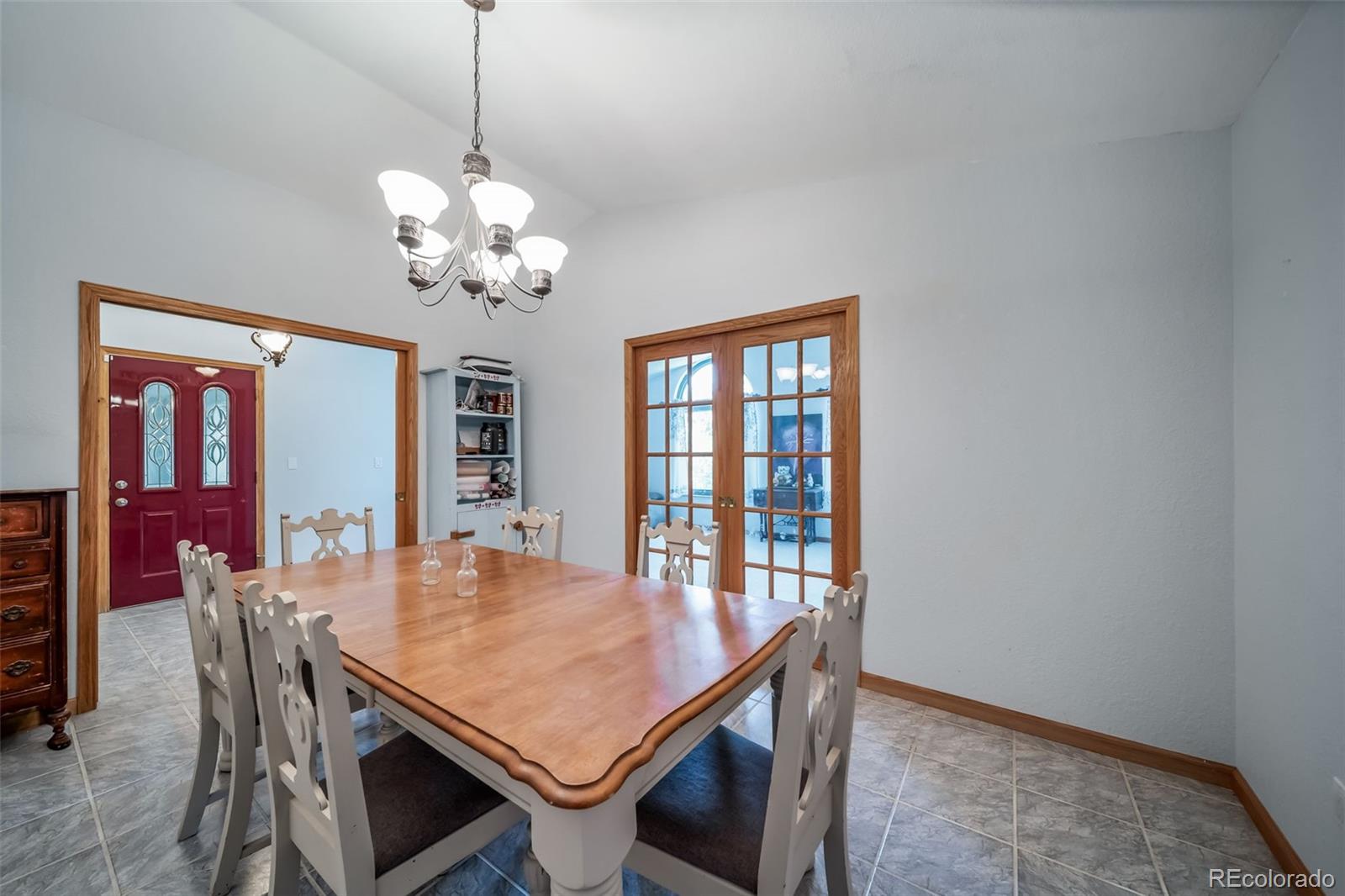 305 Kimble Avenue Swink, CO 81077 - Photo 11 of 44 a view of a dining room with furniture window and wooden floor