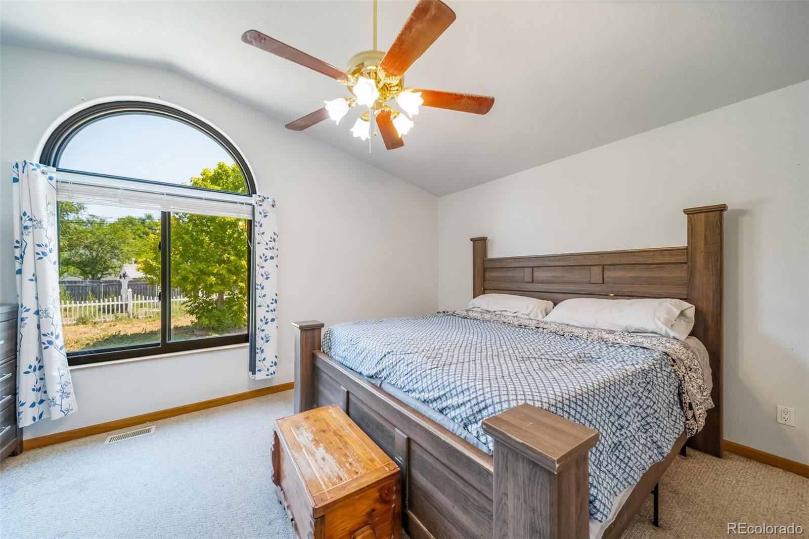 305 Kimble Avenue Swink, CO 81077 - Photo 19 of 44 a bedroom with a bed and a large window