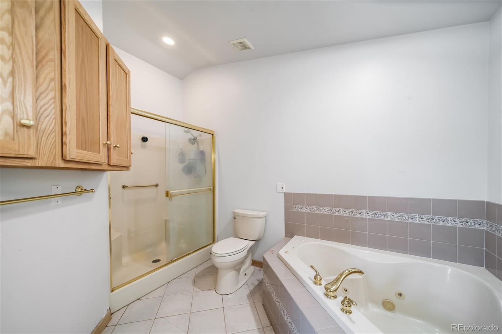 305 Kimble Avenue Swink, CO 81077 - Photo 22 of 44 a bathroom with a bathtub and shower