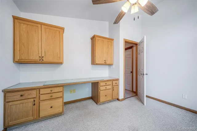 a room with cabinets and a dresser