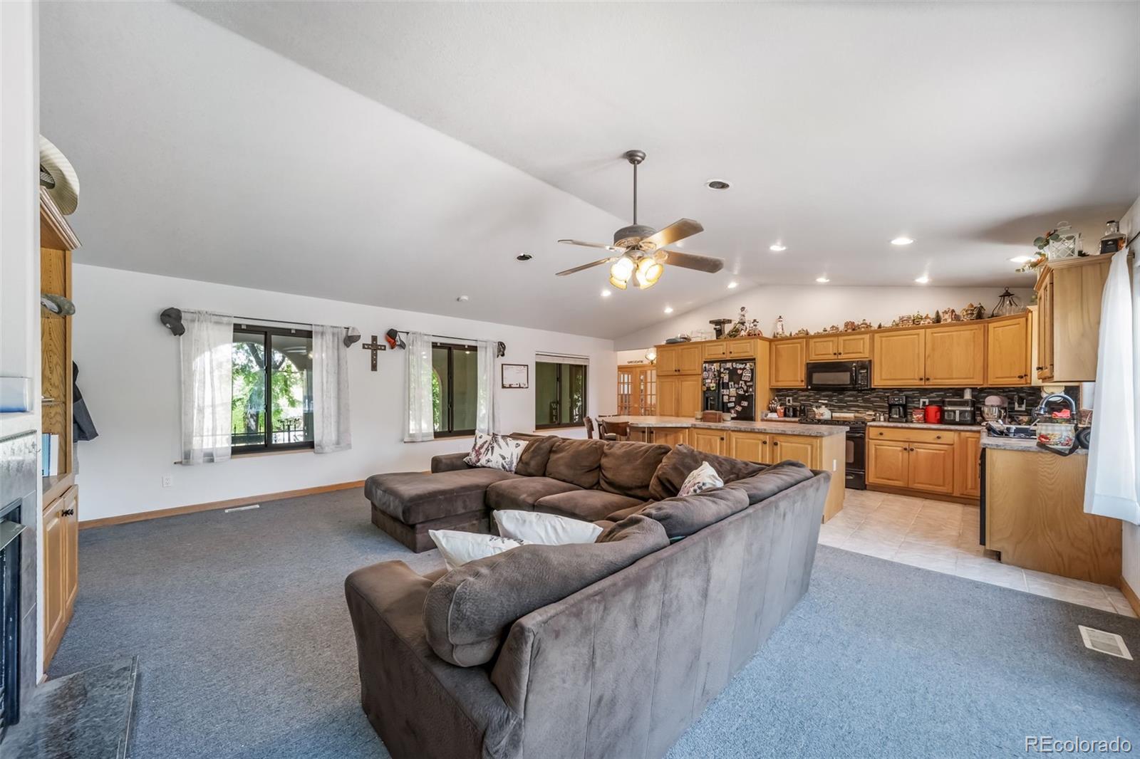 305 Kimble Avenue Swink, CO 81077 - Photo 34 of 44 a living room with furniture and kitchen view