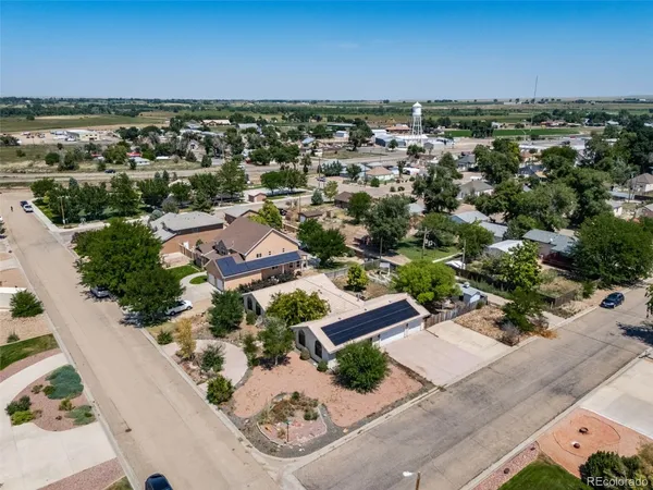 an aerial view of residential houses with outdoor space