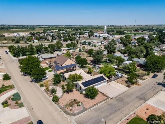 an aerial view of residential houses with outdoor space