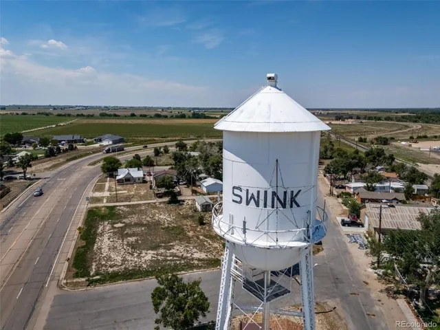 a view of a patio with a table and chairs
