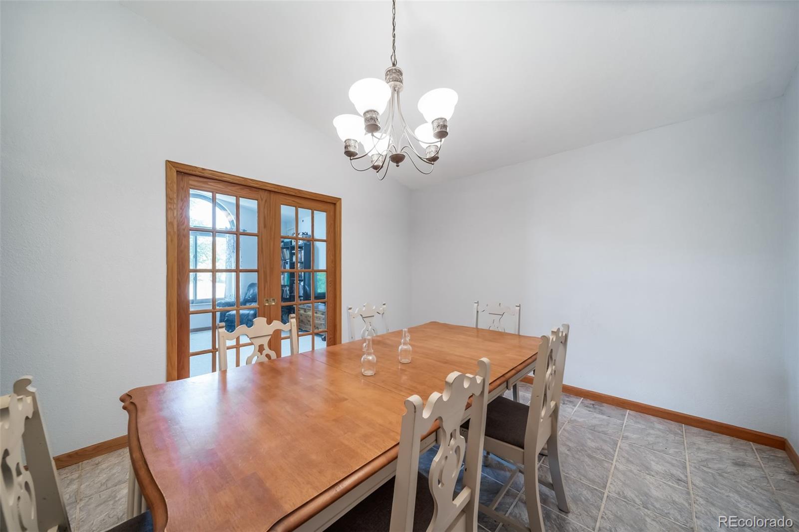 305 Kimble Avenue Swink, CO 81077 - Photo 10 of 44 a view of a dining room with furniture and wooden floor