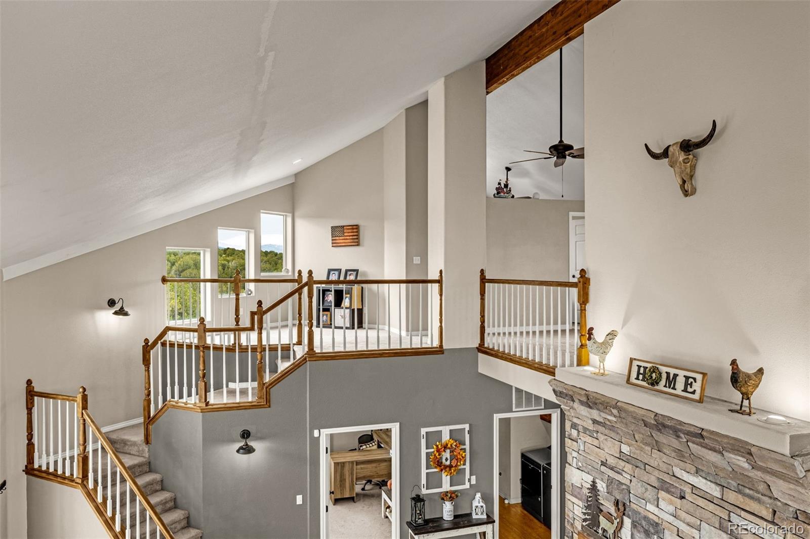 3115 Canyon Heights Road Pueblo, CO 81005 - Photo 11 of 44 a front view of a house with wooden floor and windows