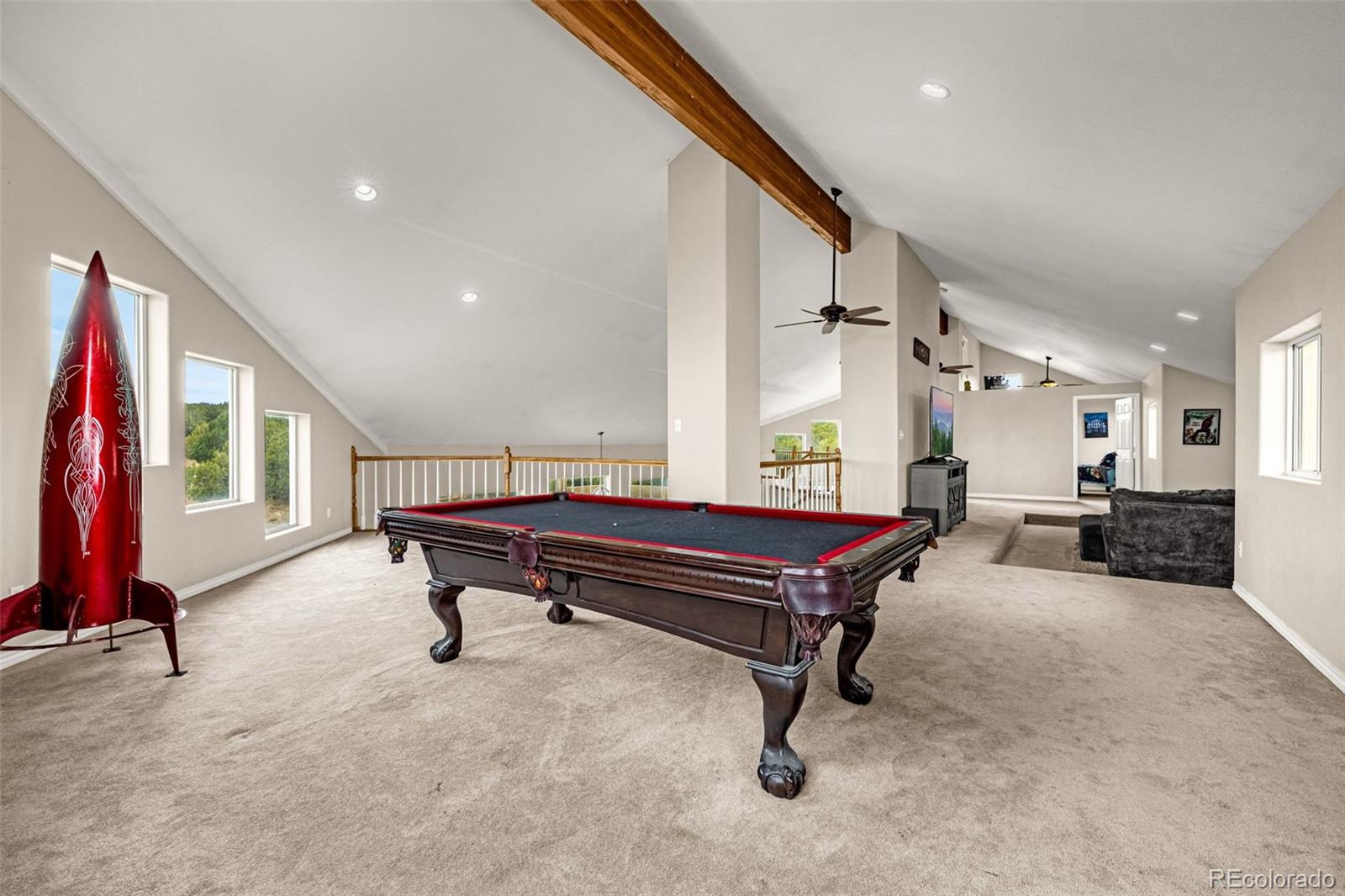 3115 Canyon Heights Road Pueblo, CO 81005 - Photo 16 of 44 a living room with furniture and a wooden floor