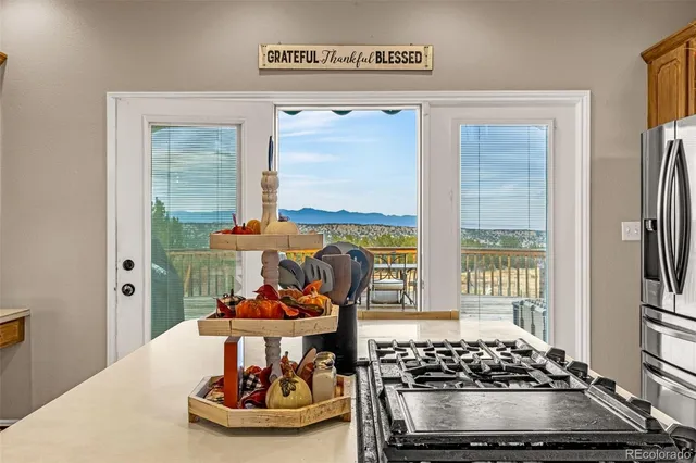 a table with chairs and a stove