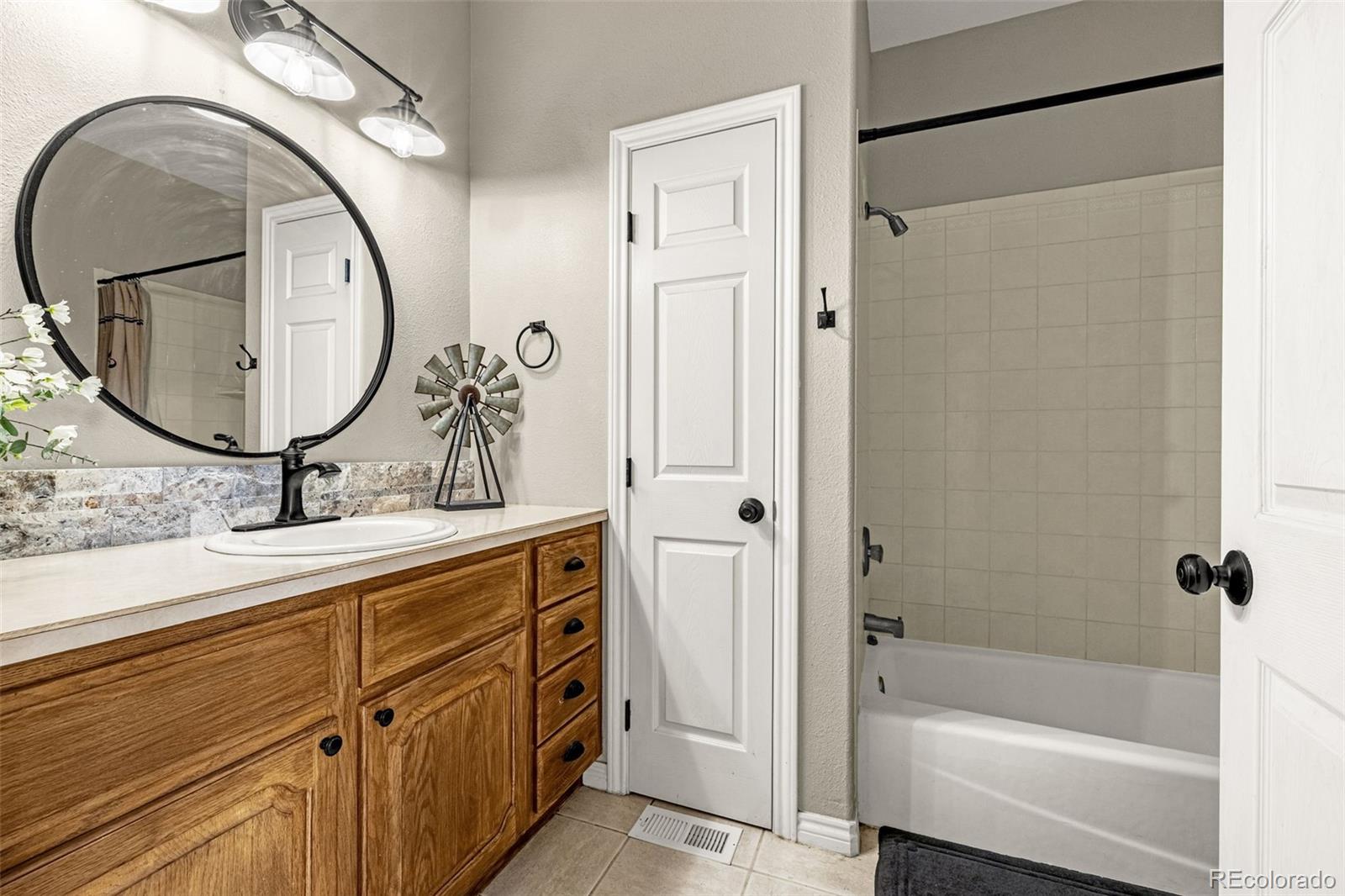 3115 Canyon Heights Road Pueblo, CO 81005 - Photo 22 of 44 a bathroom with a sink and a mirror