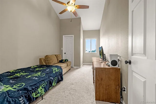 a bedroom with bed and window